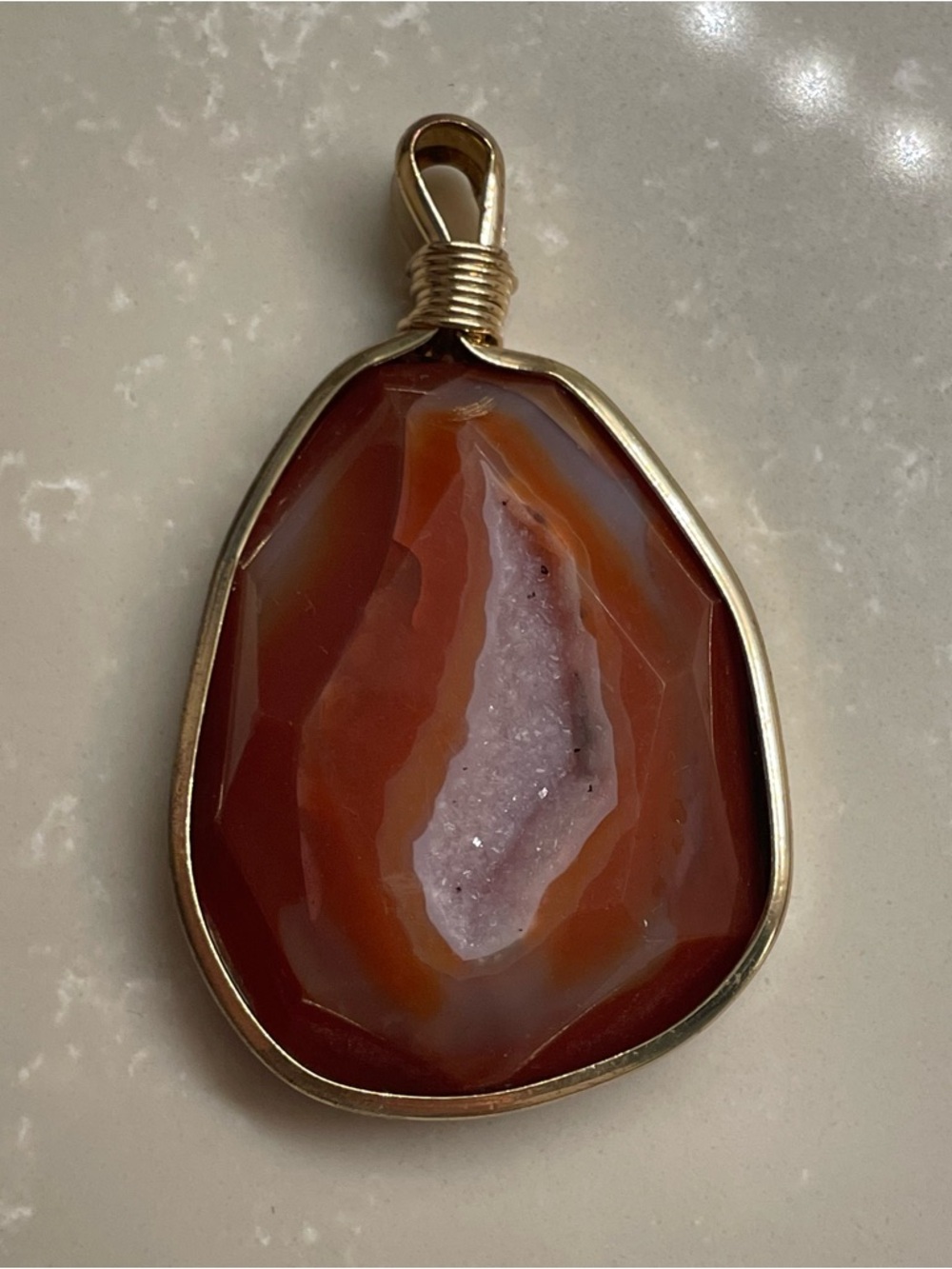 Gold-Framed Red Agate Geode Pendant